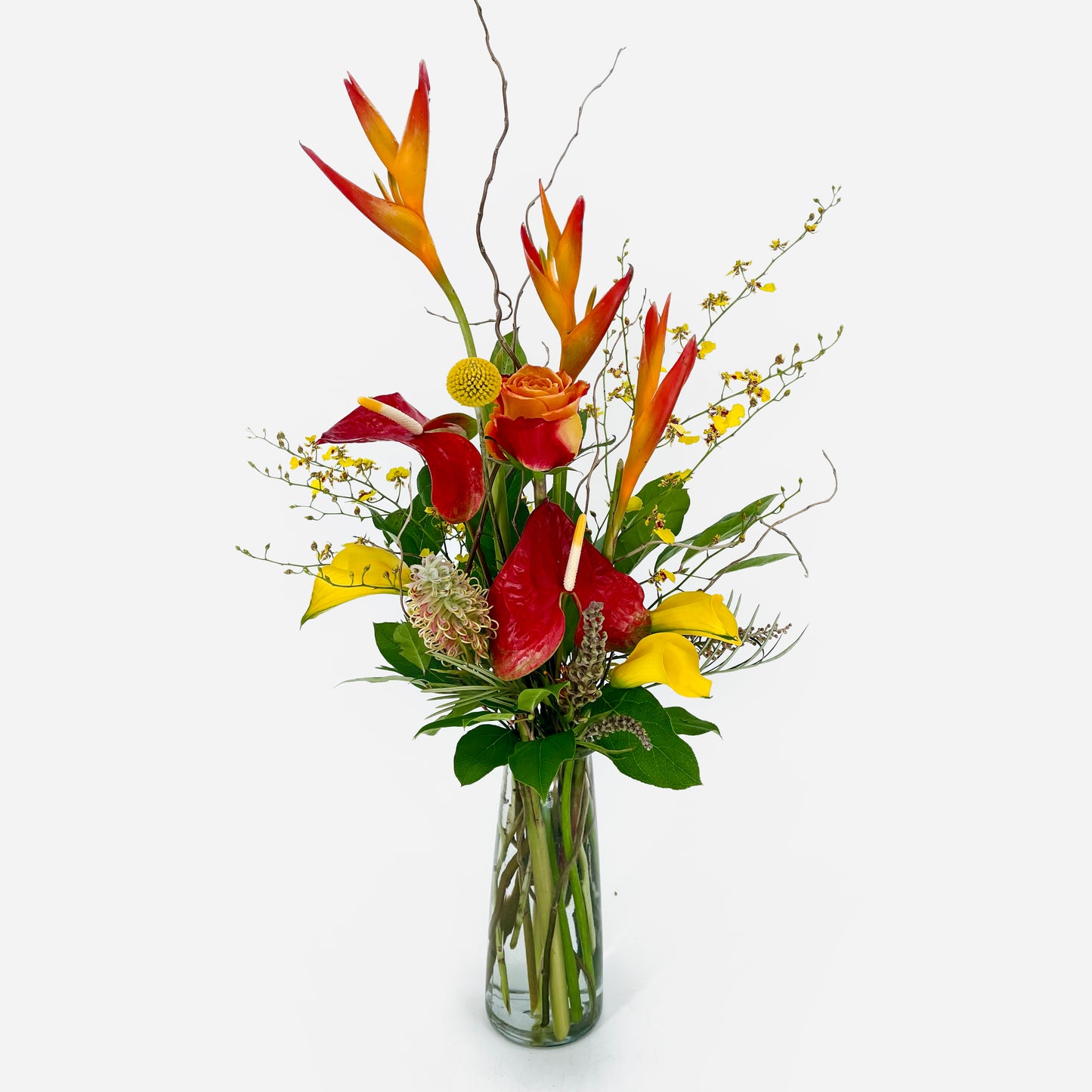 Small flower arrangement with tropic fleur, calla lilies, anthurium, orchids and curly willow from Artichokes & Pomegranates Floral Design. Order online for delivery or pickup in Santa Fe.