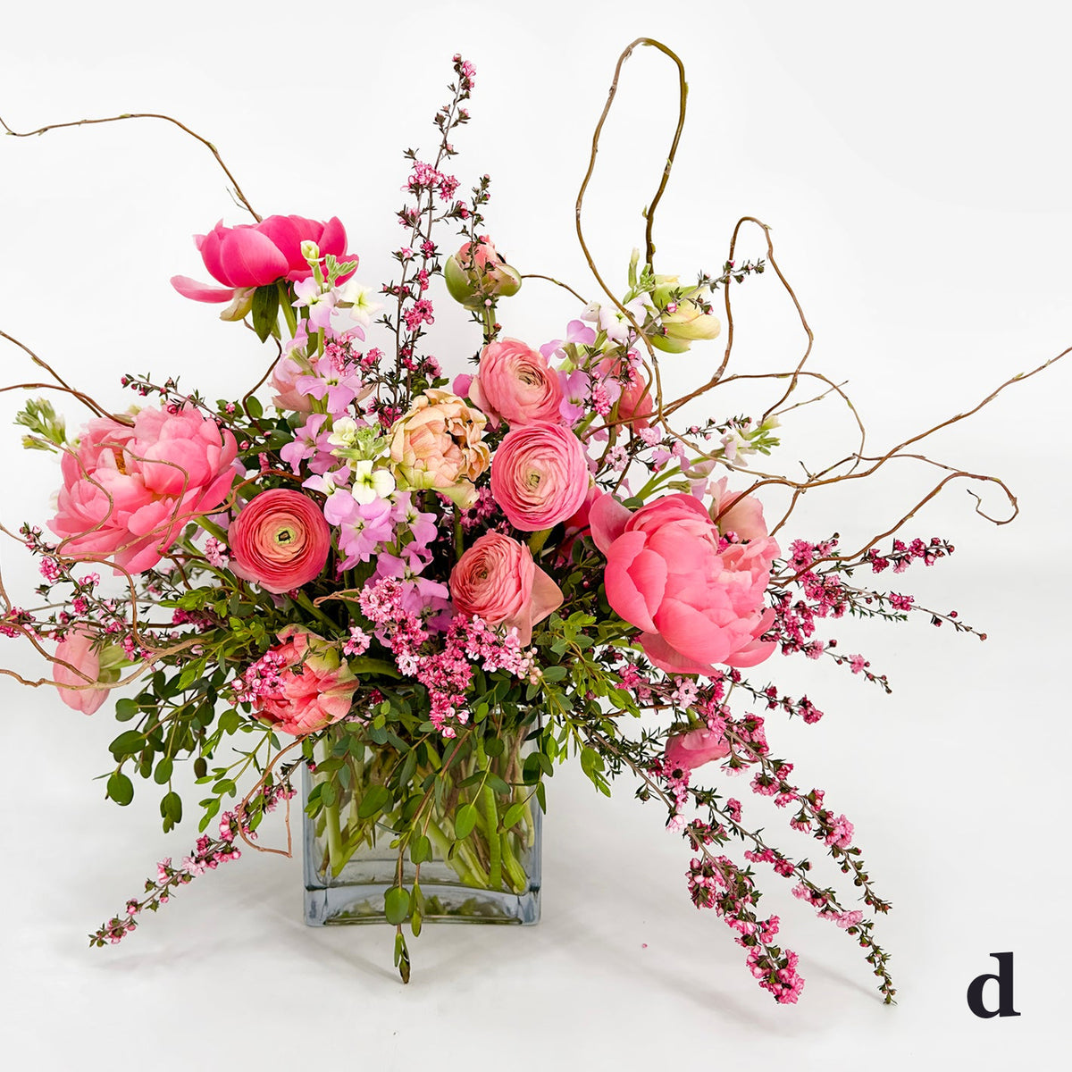 Large Low Flower Design from Artichokes and Pomegranates in Different Shades of Pink