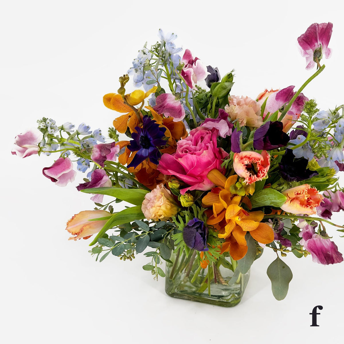Medium Low Flower Design from Artichokes and Pomegranates in Jewel Tones