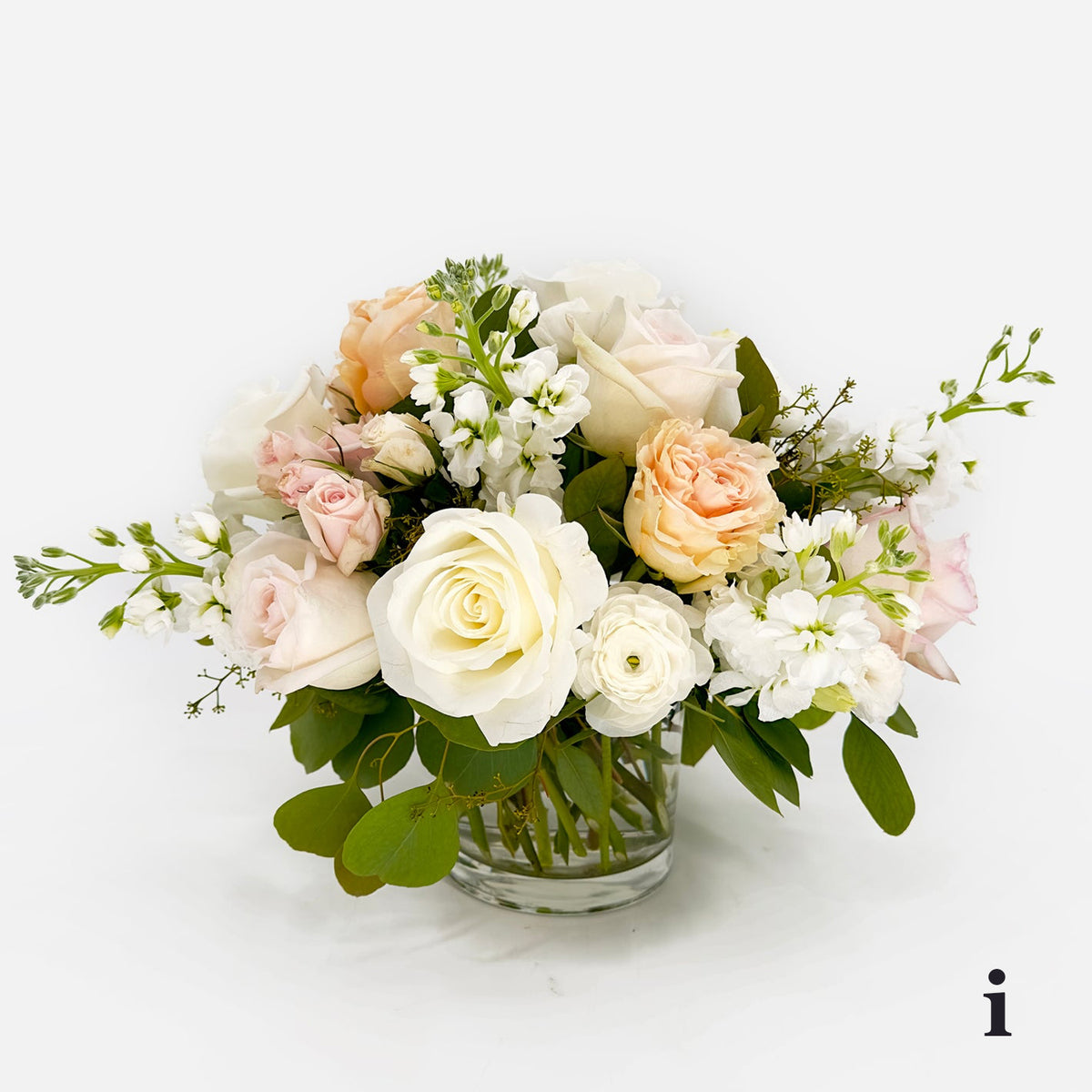 Medium Low Flower Design from Artichokes and Pomegranates in Whites and Blush Colors
