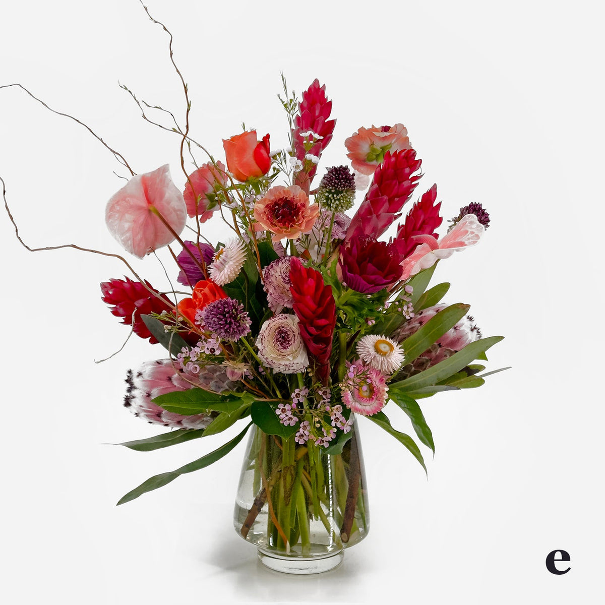 Premium Flower Design from Artichokes and Pomegranates in Pinks, Red and Purples