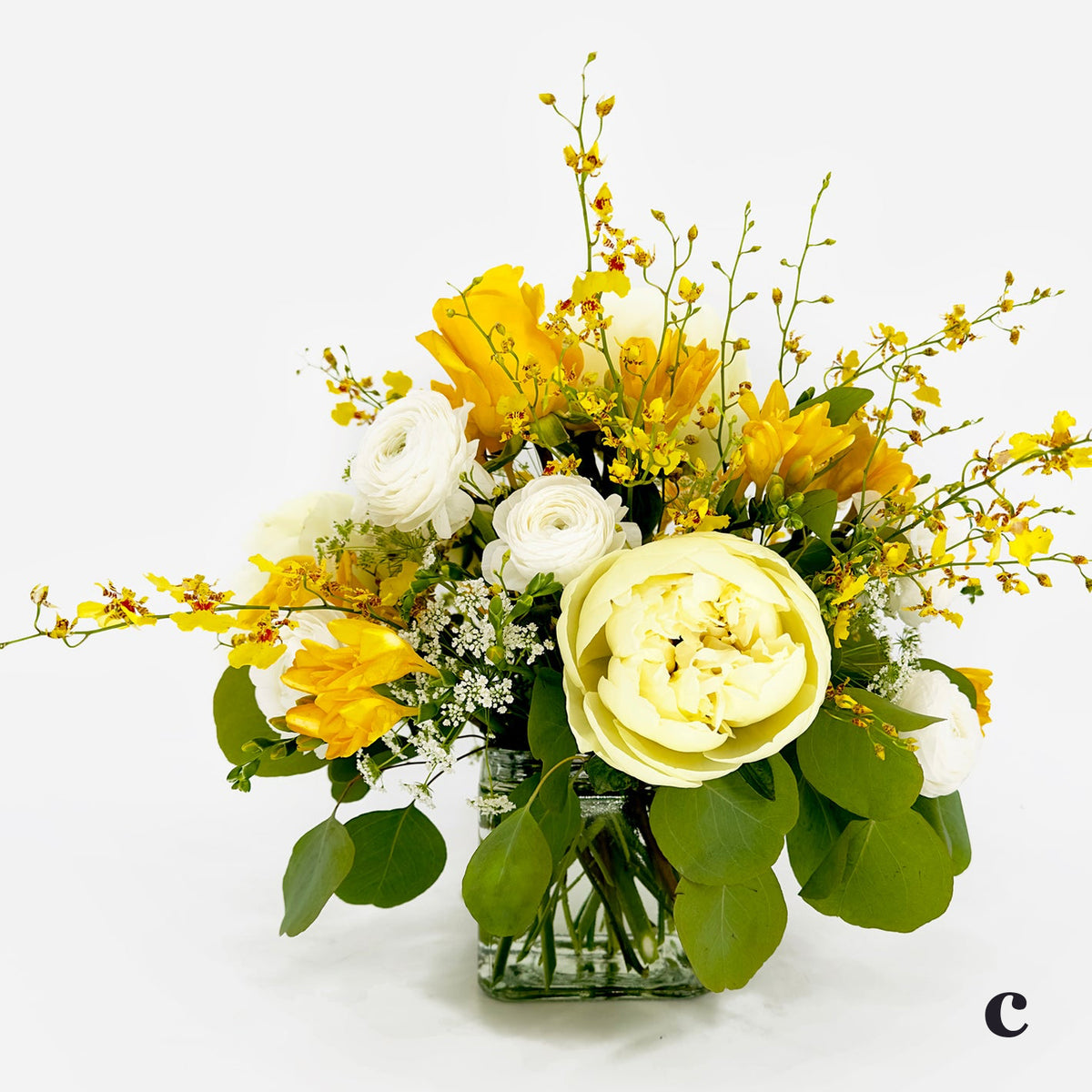 Small Low Flower Design from Artichokes and Pomegranates in Whites and Yellows