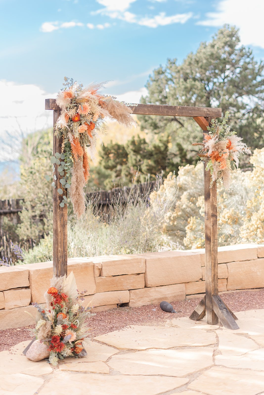 Artichokes & Pomegranates wedding ceremony flower arch in Santa Fe