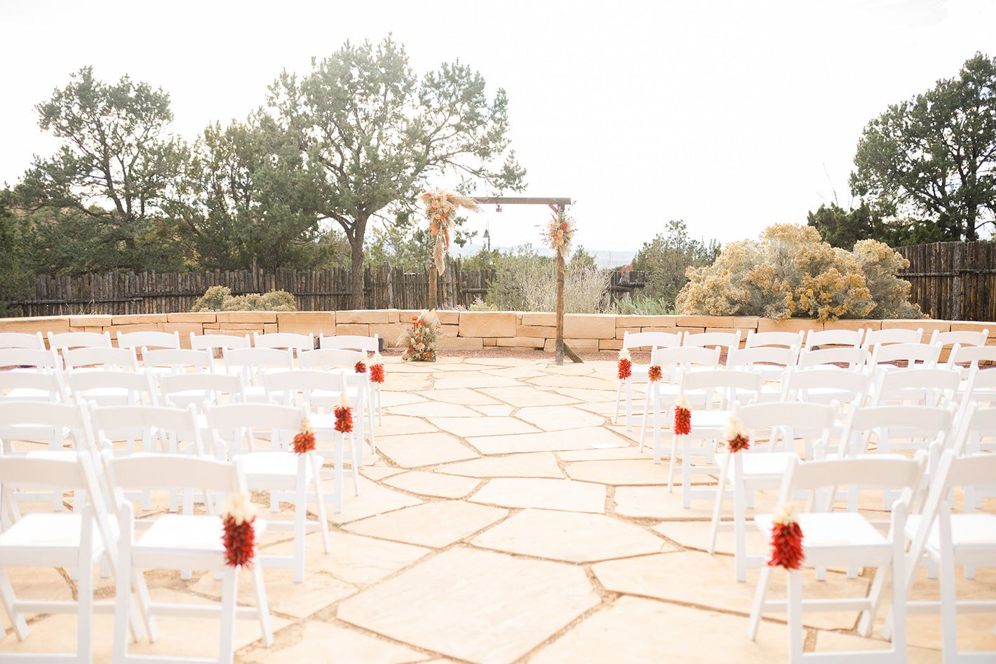 Artichokes & Pomegranates wedding ceremony flowers and arch in Santa Fe