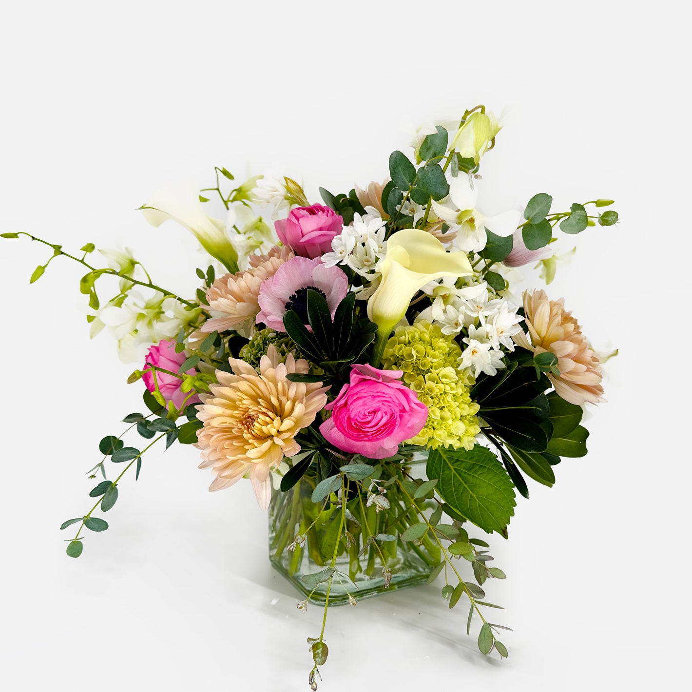 Small flower arrangement with anemones, calla lilies, ranunculus and orchids from Artichokes & Pomegranates Floral Design. Order online for delivery or pickup in Santa Fe.